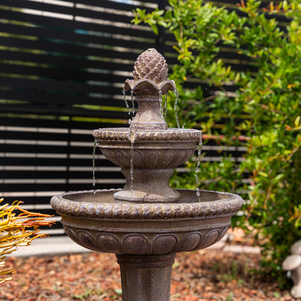 Desert Bloom — 39" Sandstone Solar Water Fountain, placed in an outdoor backyard setting