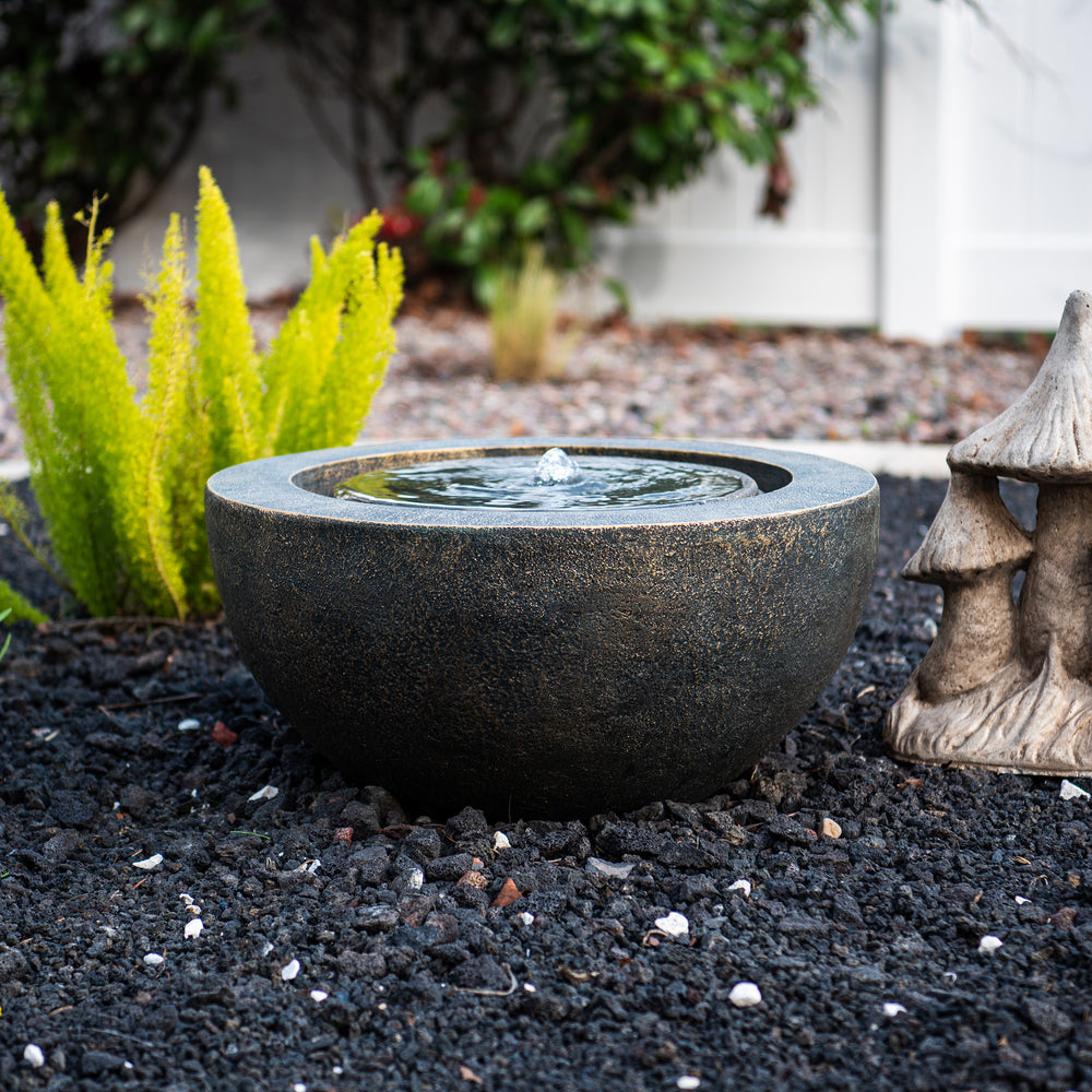 Luna Bowl — 19.8" Round LED Sphere Water Fountain, black, styled with surrounding plants