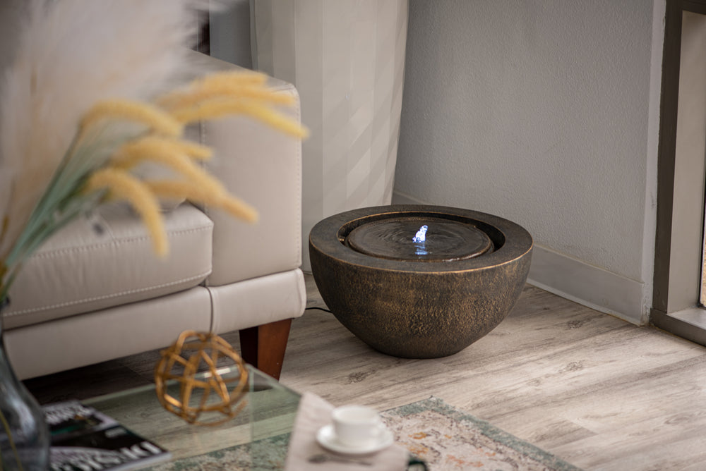 Luna Bowl — 19.8" Round LED Sphere Water Fountain, black, styled in a garden patio setting