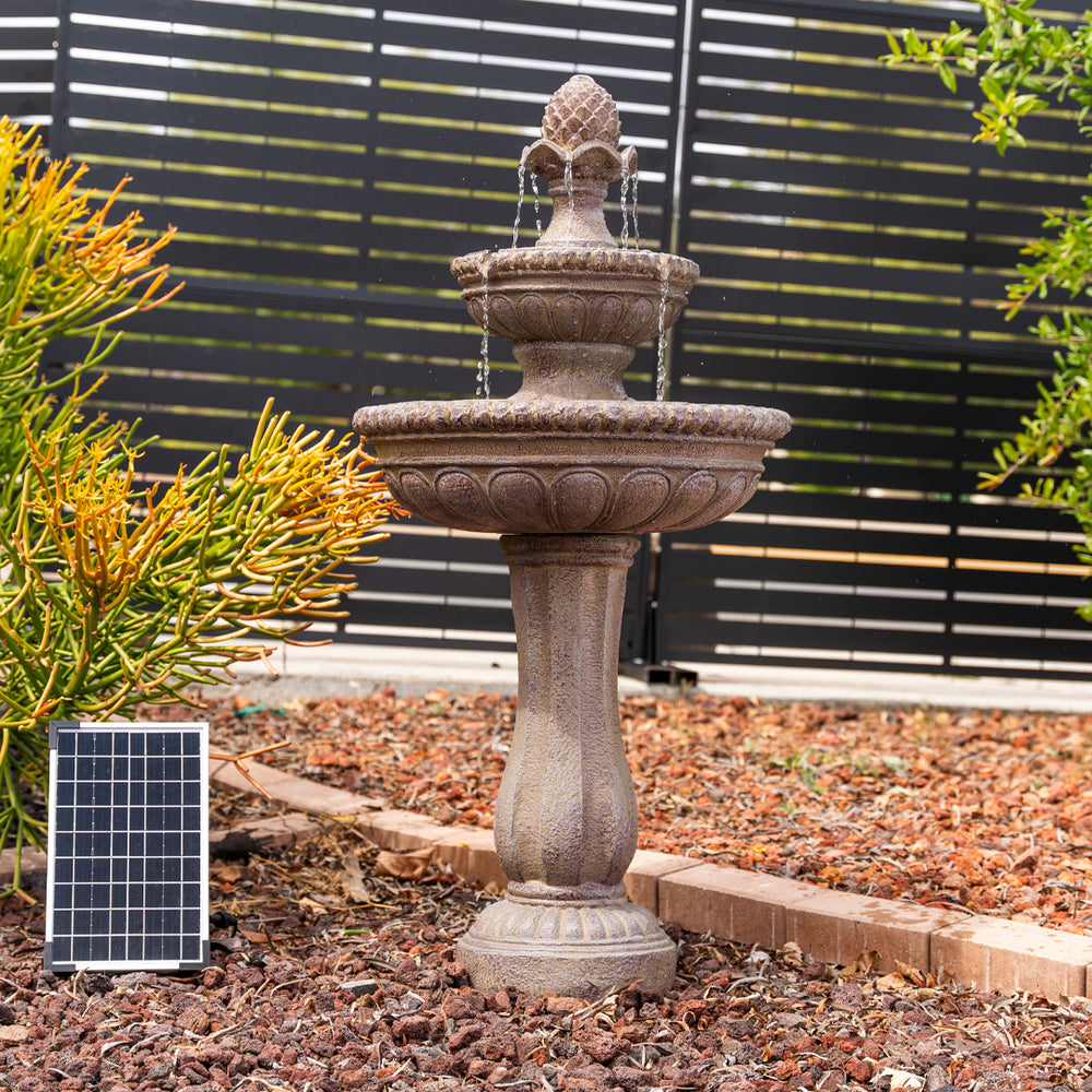Desert Bloom — 39" Sandstone Solar Water Fountain, styled in a garden patio setting